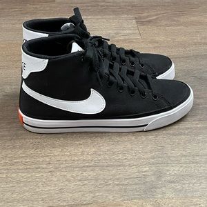Black high top Nike sneakers